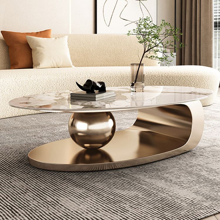 Mesa de centro elíptica de pizarra Glam de 27,6" D Mesa de cóctel abstracta con estante de piso