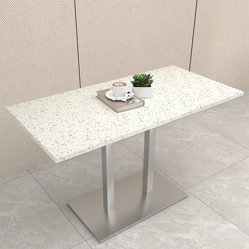 Mesa de comedor de piedra geométrica moderna con base metálica para comedor