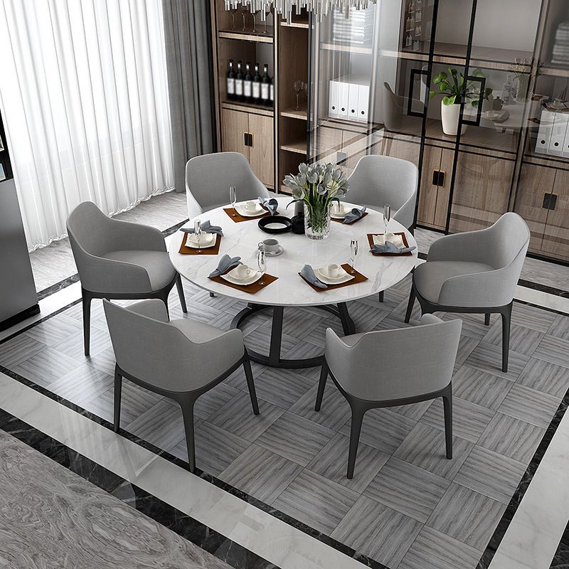 Mesa de comedor redonda contemporánea Mesa de pedestal de hierro con tapa de piedra sinterizada
