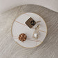 Mesa de centro con tapa de piedra Glam y mesa de cóctel redonda con base de tambor de acero