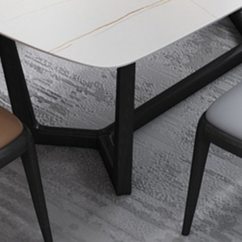 Mesa de comedor blanca de piedra rectangular moderna con base de caballete negro de cenizas