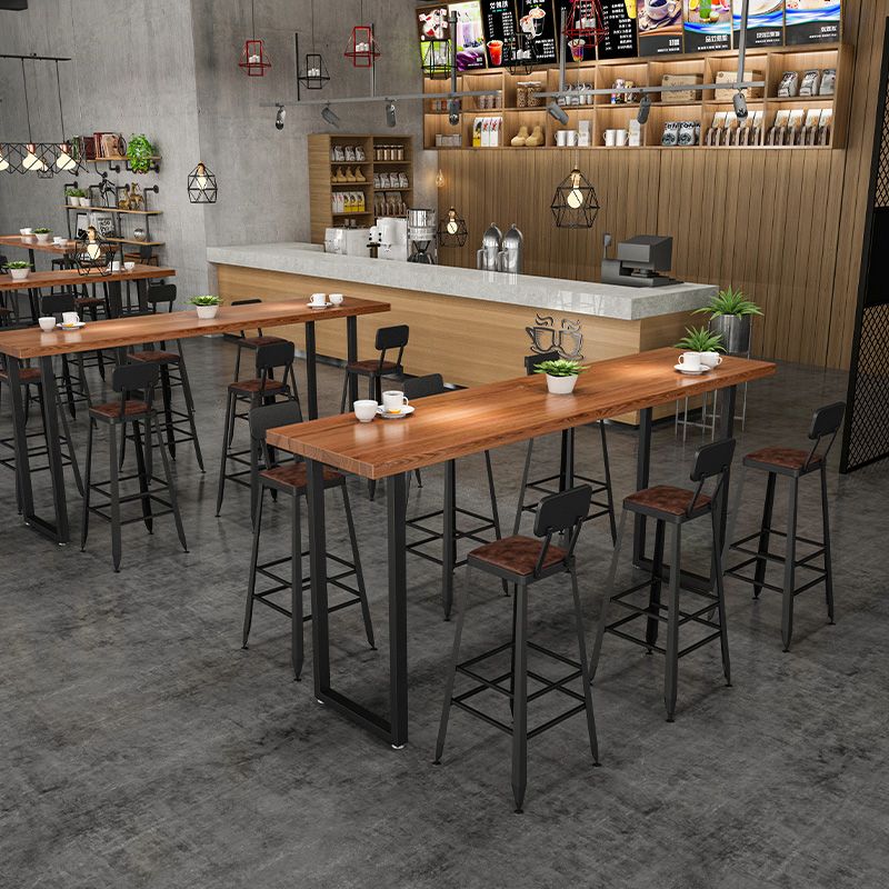 Vaste houten staaf eettafel industriële rechthoekige staaftafel met slee -basis in zwart