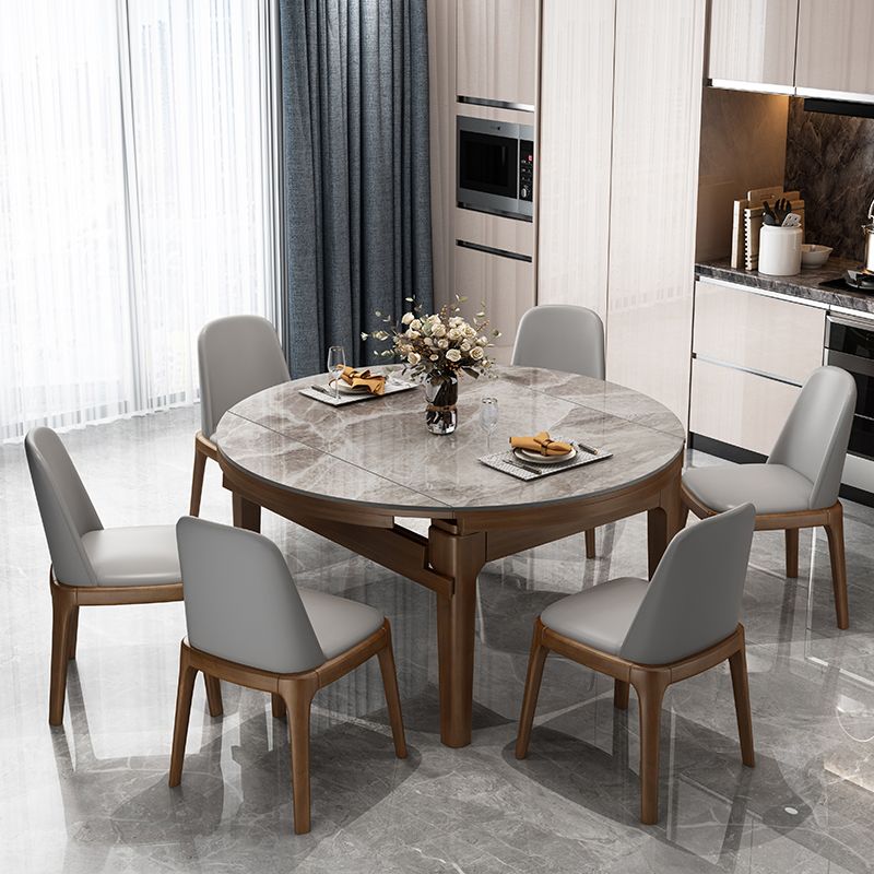 Mesa de comedor redonda moderna de piedra extensible para espacios pequeños en gris