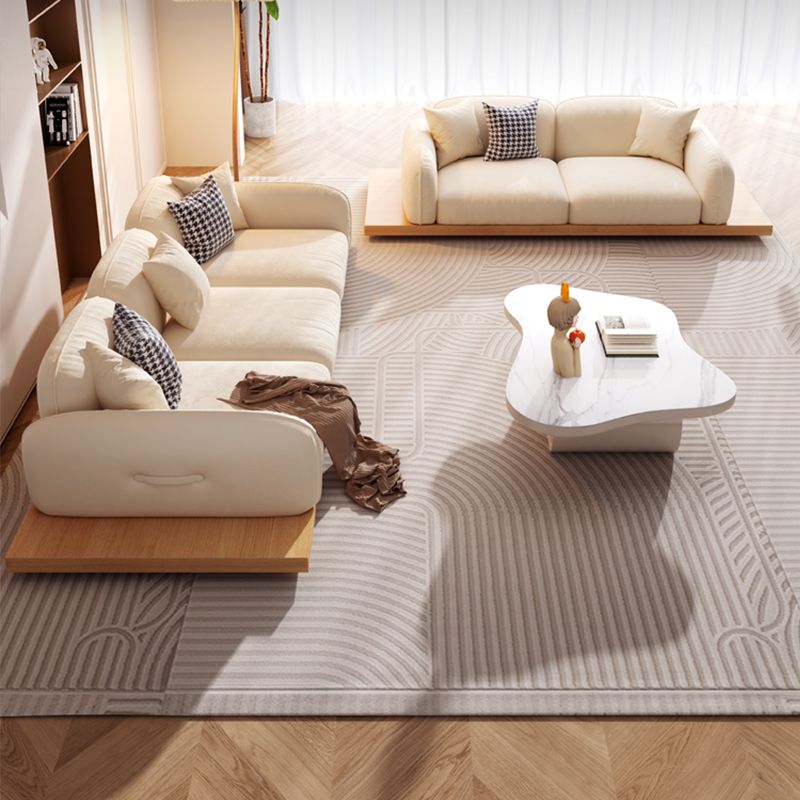 Divano sezionale di velluto contemporaneo con cuscini posteriori e braccia quadrate