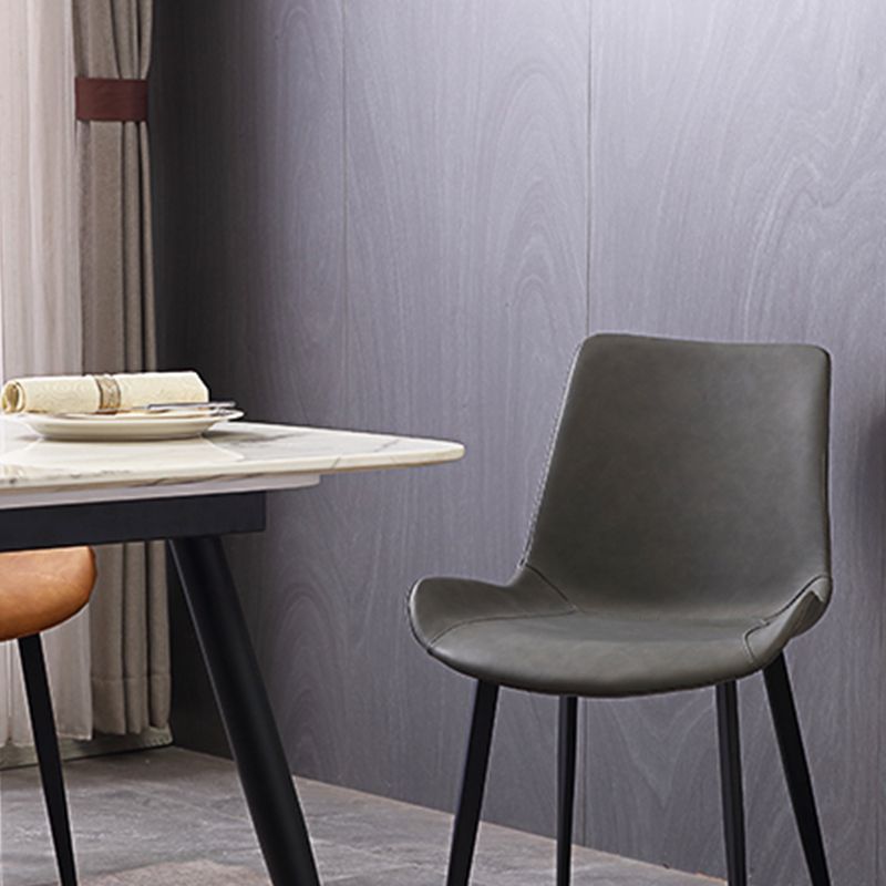 Gestoffeerde armloze eetkamerstoelen faux leer en metalen eetstoelen