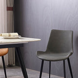 Gestoffeerde armloze eetkamerstoelen faux leer en metalen eetstoelen