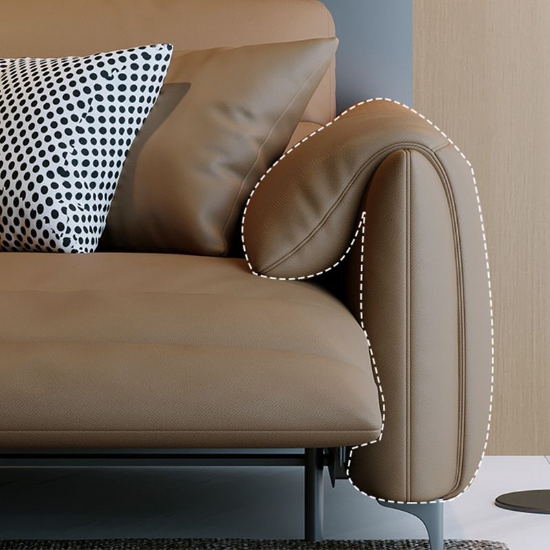 本革の枕のトップアームパワー - リビングルームにモダンなソファを押してください