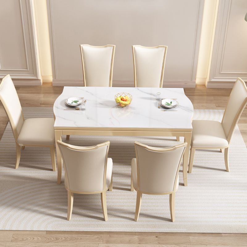 Table à manger moderne en pierre blanche avec pieds en bois massif pour le salon