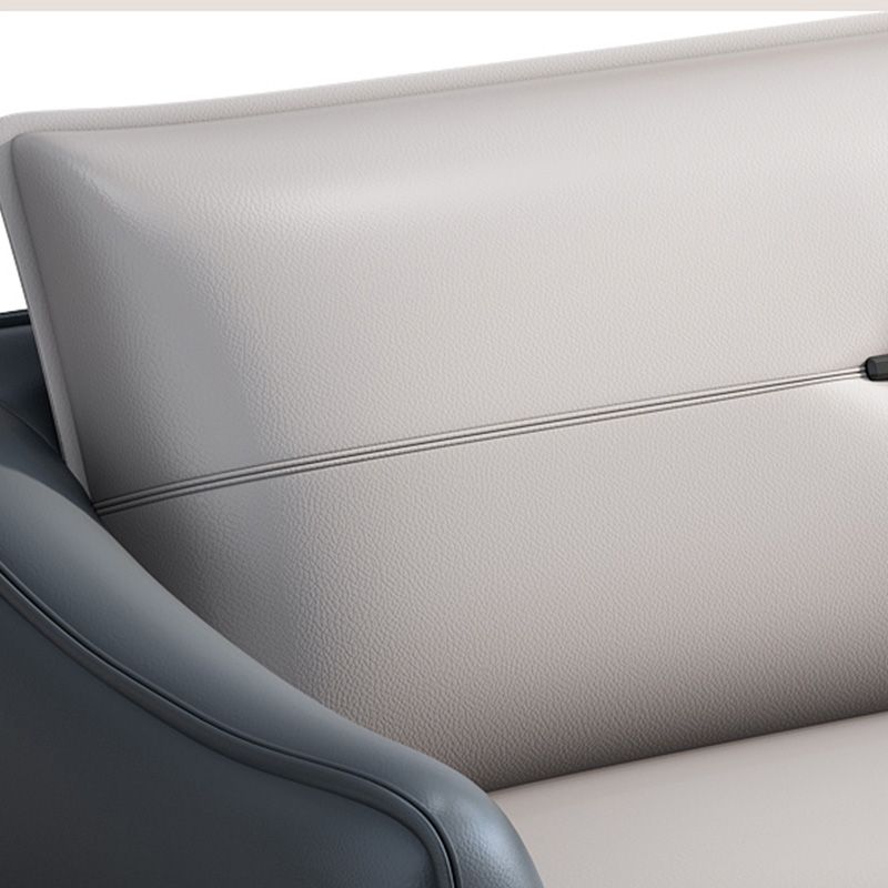 Sofá de cuero gris con cuatro patas sueltas de estilo nórdico de espalda