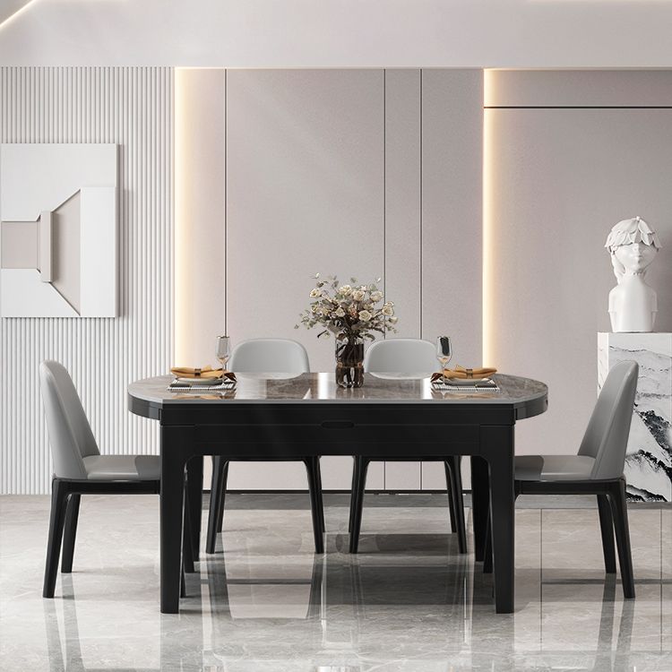 Moderner runder graues Steinoberteil ausziehbar einziehbarer Esstisch mit 4 schwarzen Beinen mit Gummiholzbeinen