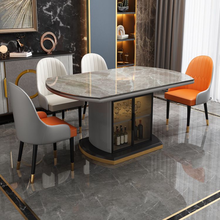 Moderne uitschuifbare eettafel rond stenen tafelblad met opbergruimte