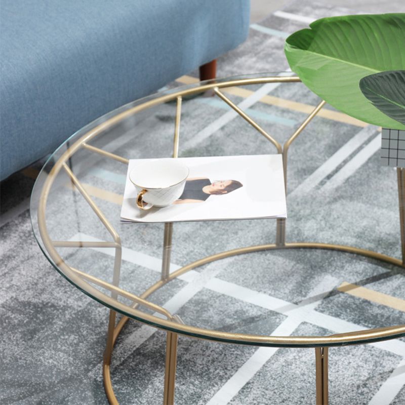 Tavolino contemporaneo con top in vetro rotondo e base di ferro