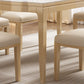 Table à manger moderne en pierre blanche avec pieds en bois massif pour le salon