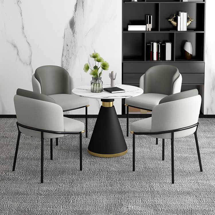 Tavolo da pranzo rotondo contemporaneo in metallo tavolo in pietra sinterizzata con base piedistallo