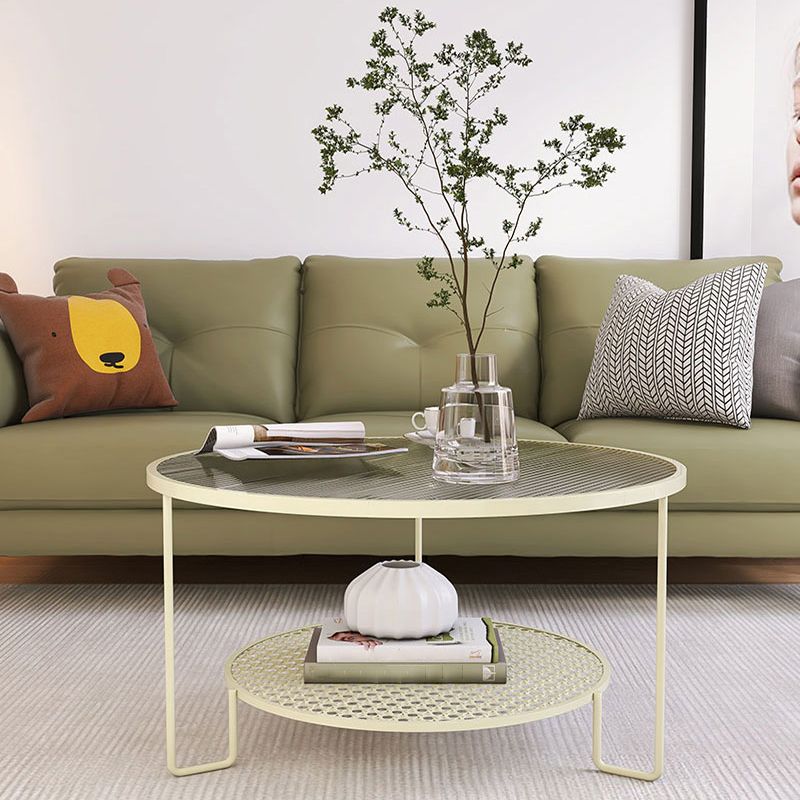 Tavolino moderno in vetro rotondo con 3 zampe di ferro e scaffale