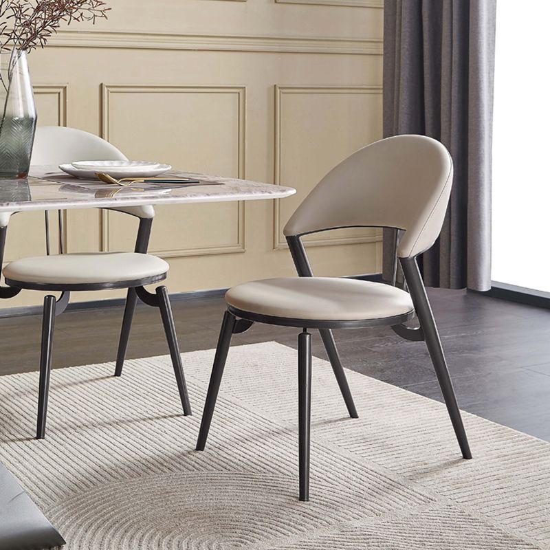 Minimalistische stijl armloze open achterkant stoelen faux lederen eetkamerstoelen