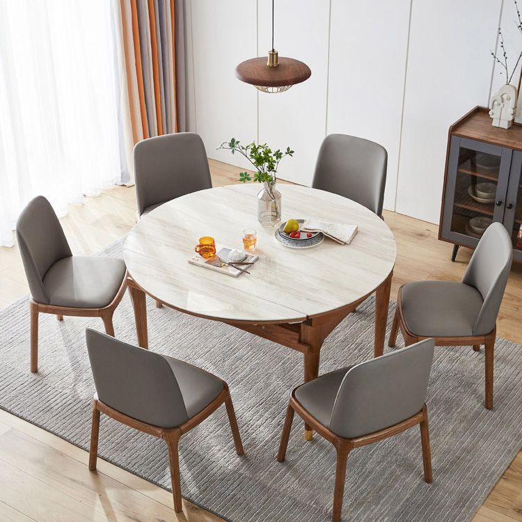 Tavolo da pranzo moderno scalabile in pietra con gambe in legno massello per sala da pranzo