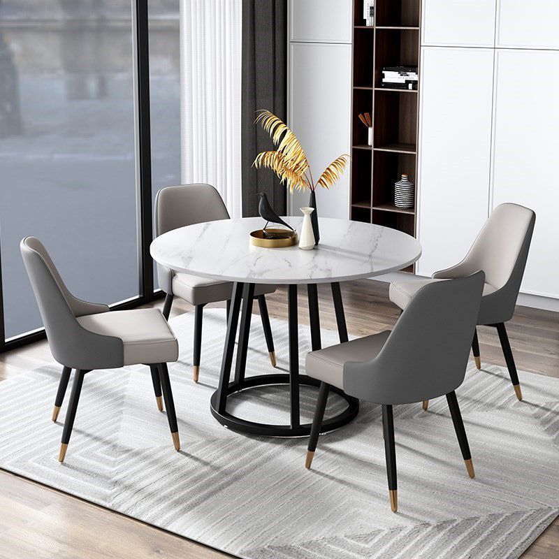 Mesa de comedor de base de hierro negro redondo Mesa de pedestal de piedra moderna