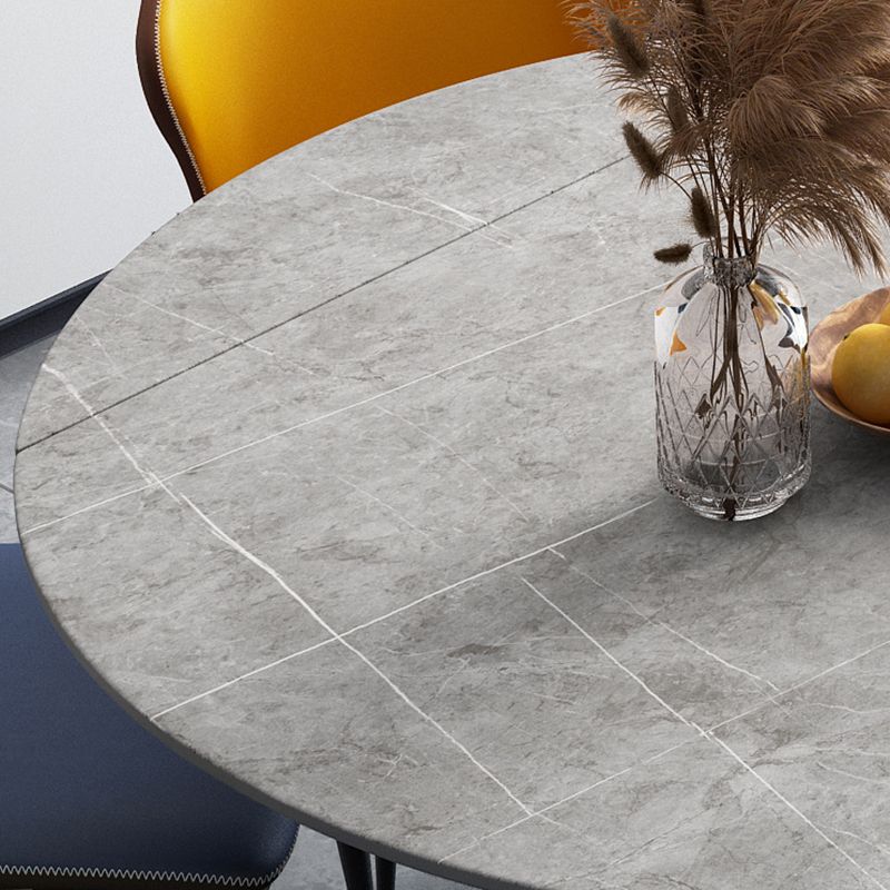 Moderne gesinterde stenen eettafel ronde tafel met metalen poten voor thuisgebruik