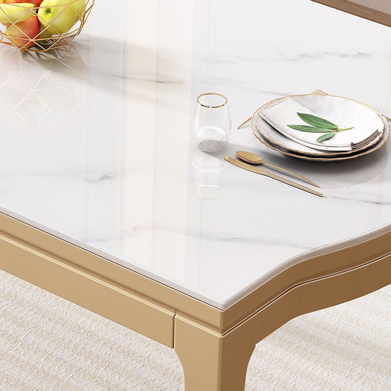 Table à manger moderne en pierre blanche avec pieds en bois massif pour le salon