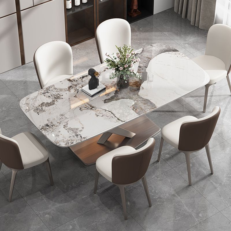 Mesa de comedor de piedra rectangular de lujo con acero dorado X-base