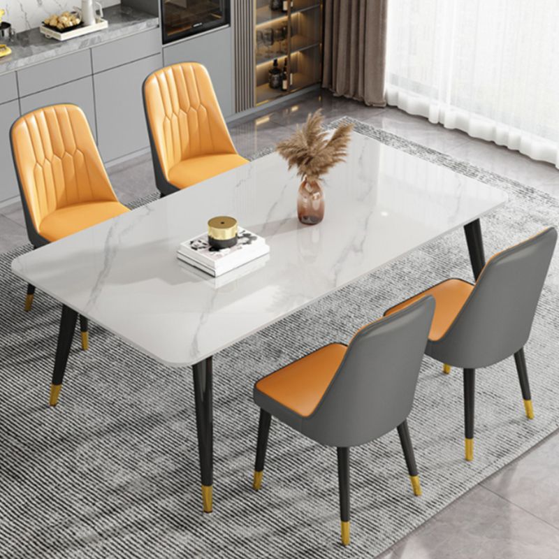 Mesa de comedor de piedra rectangular de lujo con 4 patas de acero dorado y negro