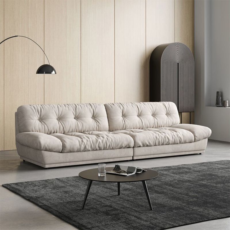 Canapé contemporain sans bras en velours blanc avec dos touflé pour le salon