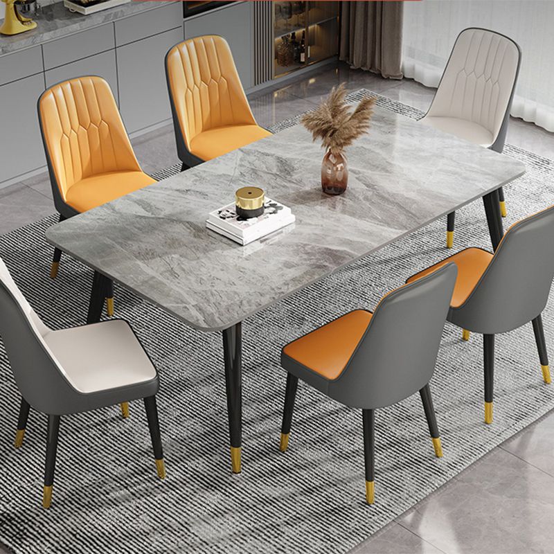 Mesa de comedor de piedra rectangular de lujo con 4 patas de acero dorado y negro