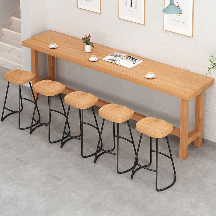 Modern Beige Wood Bar Dining Table Rectangle Indoor Bistro Table with Footrest Clearhalo 'Bar Furniture' 'Bar Tables' 'bar_tables' 'furn' 'furn_bar_tables' 'Furniture' 'furniture_bar_tables' 'Kitchen & Dining Furniture' 1200x1200_f0a0e7fc-1a7a-4a48-9d96-3c079e35ed61