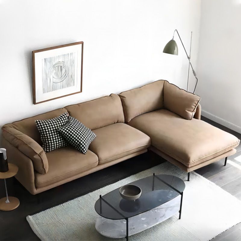 Seccionales de color marrón claro/sofá con almohada y brazo superior de almohada