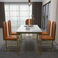 Esstisch im Glam-Stil mit Steinplatte und goldenem Sockel für das Wohnzimmer
