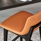 Taburete de bar de cuero con respaldo para mostrador Bristol con patas de madera