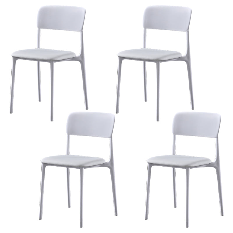 Modern Style Plastic Dining Chairs Open Back Dining Stackable Side Chairs for Kitchen White Faux Leather 4 Piece Set Clearhalo ' kitchen&dining_furn' 'Dining Chairs' 'Dining Tables & Seating' 'dining_chair' 'furn' 'furn_dining_chair' 'Furniture' 'furniture_dining_chair' 'Kitchen & Dining Furniture' 'kitchen' 3910179