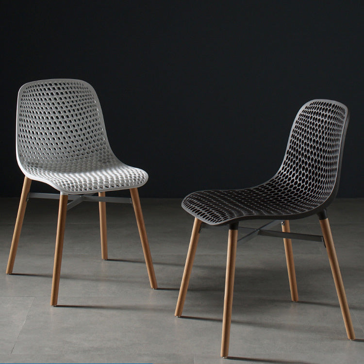 Scandinavian Style Plastic Dining Armless Chair Solid Back Chair with Wooden Legs Clearhalo ' kitchen&dining_furn' 'Dining Chairs' 'Dining Tables & Seating' 'dining_chair' 'furn' 'furn_dining_chair' 'Furniture' 'furniture_dining_chair' 'Kitchen & Dining Furniture' 'kitchen' 4039115