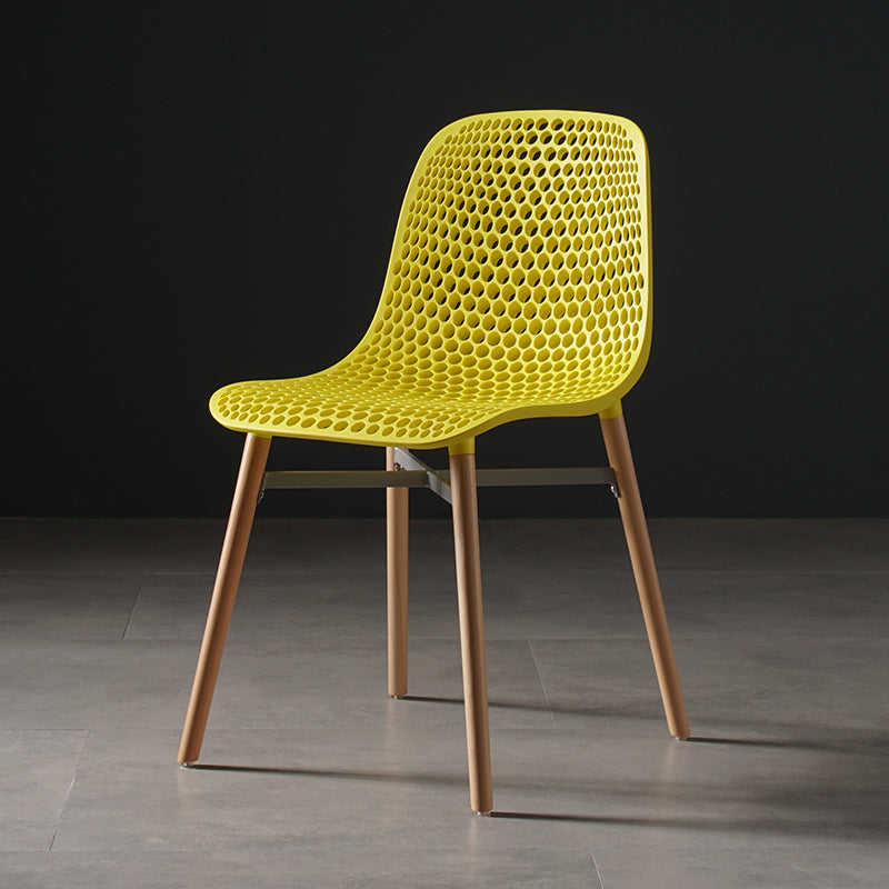 Scandinavian Style Plastic Dining Armless Chair Solid Back Chair with Wooden Legs Yellow 1 Piece Clearhalo ' kitchen&dining_furn' 'Dining Chairs' 'Dining Tables & Seating' 'dining_chair' 'furn' 'furn_dining_chair' 'Furniture' 'furniture_dining_chair' 'Kitchen & Dining Furniture' 'kitchen' 4039121