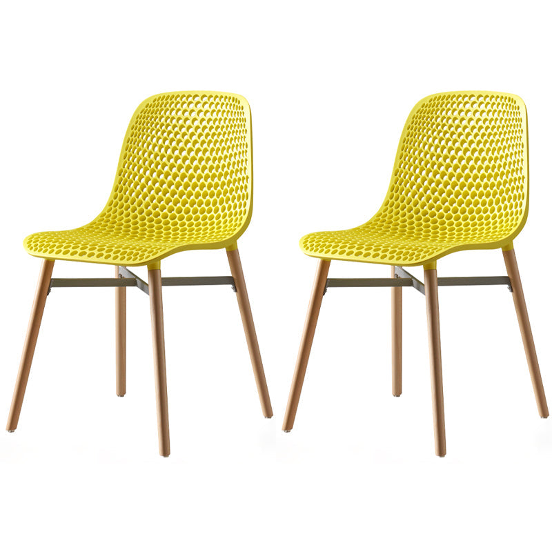 Scandinavian Style Plastic Dining Armless Chair Solid Back Chair with Wooden Legs Yellow 2 Piece Set Clearhalo ' kitchen&dining_furn' 'Dining Chairs' 'Dining Tables & Seating' 'dining_chair' 'furn' 'furn_dining_chair' 'Furniture' 'furniture_dining_chair' 'Kitchen & Dining Furniture' 'kitchen' 4039124