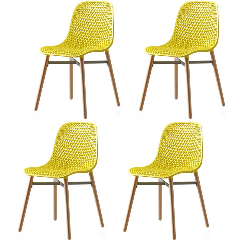 Scandinavian Style Plastic Dining Armless Chair Solid Back Chair with Wooden Legs Yellow 4 Piece Set Clearhalo ' kitchen&dining_furn' 'Dining Chairs' 'Dining Tables & Seating' 'dining_chair' 'furn' 'furn_dining_chair' 'Furniture' 'furniture_dining_chair' 'Kitchen & Dining Furniture' 'kitchen' 4039126