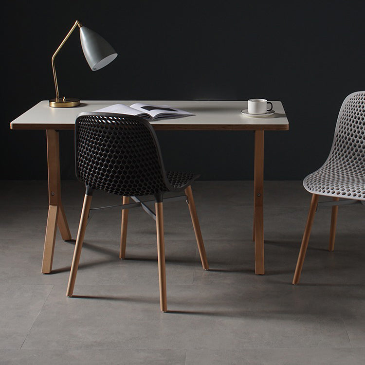 Scandinavian Style Plastic Dining Armless Chair Solid Back Chair with Wooden Legs Clearhalo ' kitchen&dining_furn' 'Dining Chairs' 'Dining Tables & Seating' 'dining_chair' 'furn' 'furn_dining_chair' 'Furniture' 'furniture_dining_chair' 'Kitchen & Dining Furniture' 'kitchen' 4039137