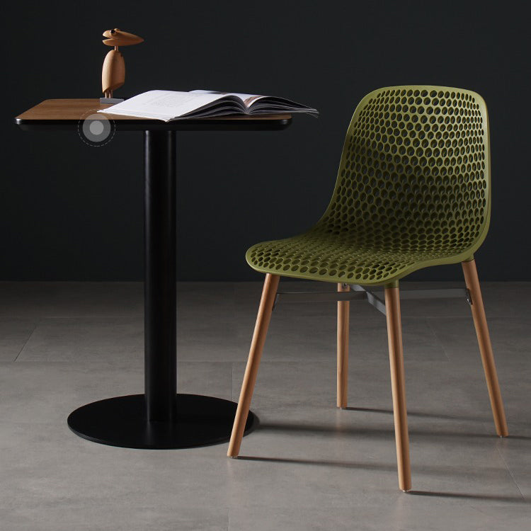 Scandinavian Style Plastic Dining Armless Chair Solid Back Chair with Wooden Legs Clearhalo ' kitchen&dining_furn' 'Dining Chairs' 'Dining Tables & Seating' 'dining_chair' 'furn' 'furn_dining_chair' 'Furniture' 'furniture_dining_chair' 'Kitchen & Dining Furniture' 'kitchen' 4039139