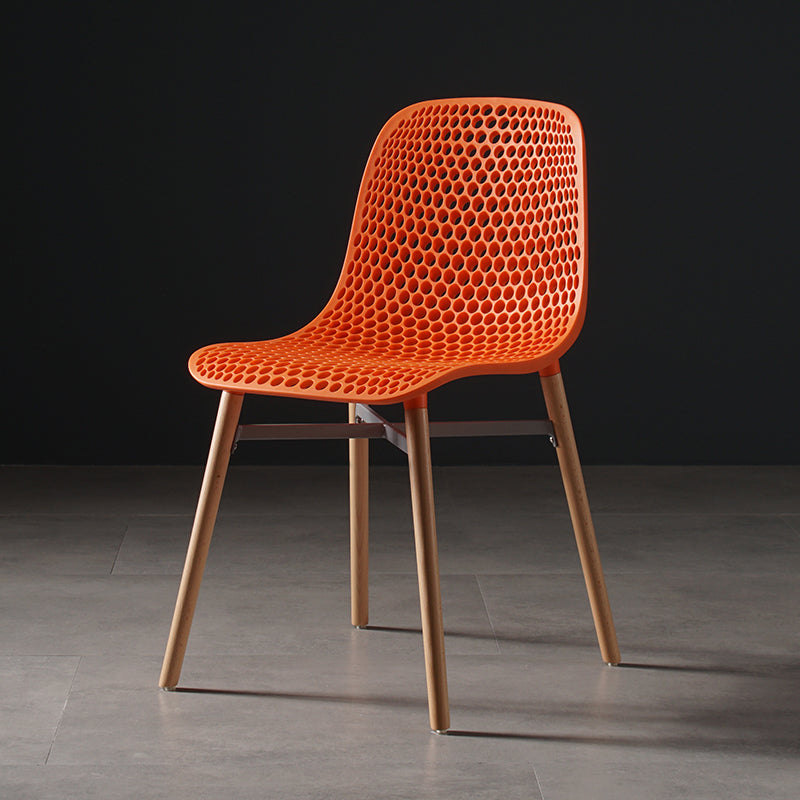 Scandinavian Style Plastic Dining Armless Chair Solid Back Chair with Wooden Legs Orange 1 Piece Clearhalo ' kitchen&dining_furn' 'Dining Chairs' 'Dining Tables & Seating' 'dining_chair' 'furn' 'furn_dining_chair' 'Furniture' 'furniture_dining_chair' 'Kitchen & Dining Furniture' 'kitchen' 4039144