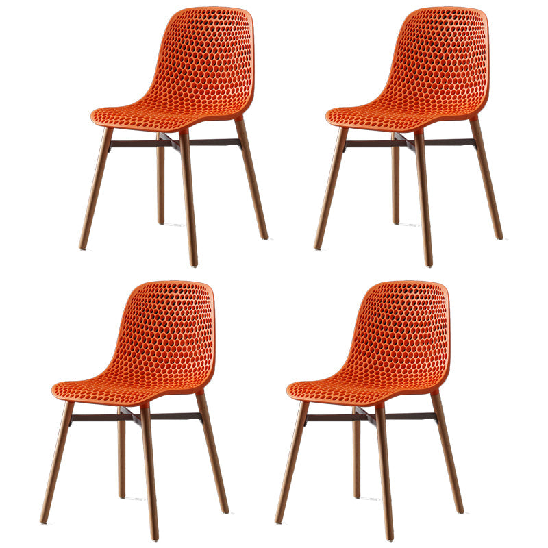Scandinavian Style Plastic Dining Armless Chair Solid Back Chair with Wooden Legs Orange 4 Piece Set Clearhalo ' kitchen&dining_furn' 'Dining Chairs' 'Dining Tables & Seating' 'dining_chair' 'furn' 'furn_dining_chair' 'Furniture' 'furniture_dining_chair' 'Kitchen & Dining Furniture' 'kitchen' 4039146