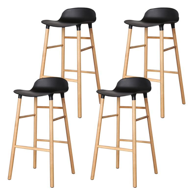 Modern Counter Bar Stool Armless Plastic Indoor Bar Stool with Footrest and Wood Base Black 4 Piece Set Clearhalo 'Bar Furniture' 'Bar Stools' 'bar_stools' 'furn' 'furn_bar_stools' 'furniture_bar_stools' 'Kitchen & Dining Furniture' 'kitchen&dining_furn' 'kitchen' 'kitchen_furn' Furniture' 4184414