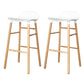 Modern Counter Bar Stool Armless Plastic Indoor Bar Stool with Footrest and Wood Base White 2 Piece Set Clearhalo 'Bar Furniture' 'Bar Stools' 'bar_stools' 'furn' 'furn_bar_stools' 'furniture_bar_stools' 'Kitchen & Dining Furniture' 'kitchen&dining_furn' 'kitchen' 'kitchen_furn' Furniture' 4184416