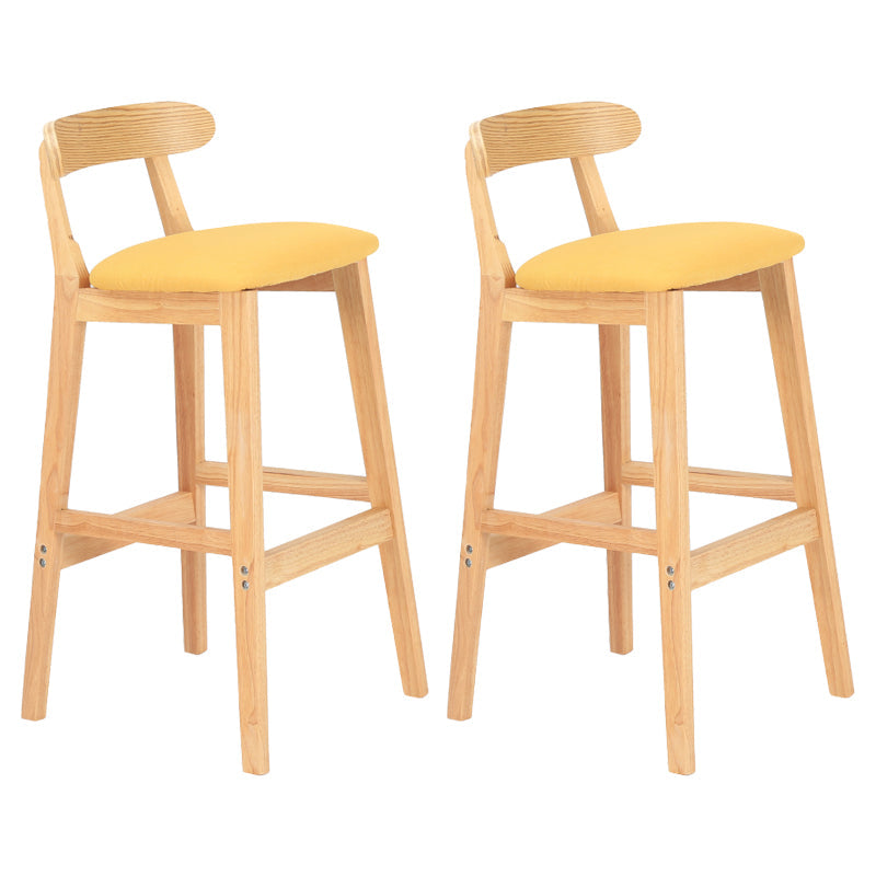 Modern Armless Counter Stool Wood Household Bar Stool with Pedal and Cushion Yellow Natural 2 Piece Set Clearhalo 'Bar Furniture' 'Bar Stools' 'bar_stools' 'furn' 'furn_bar_stools' 'furniture_bar_stools' 'Kitchen & Dining Furniture' 'kitchen&dining_furn' 'kitchen' 'kitchen_furn' Furniture' 4212095