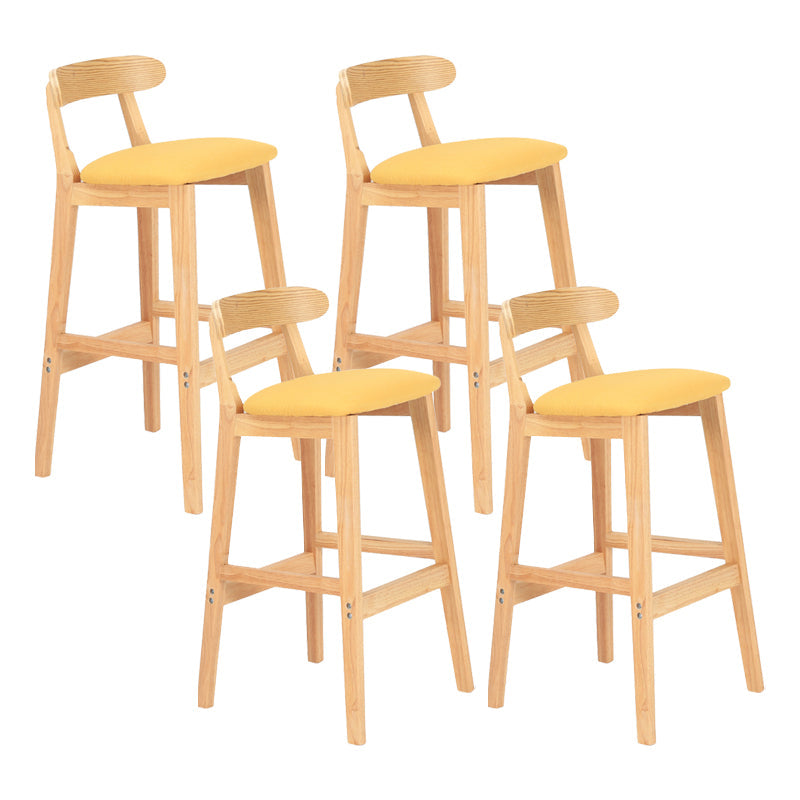 Modern Armless Counter Stool Wood Household Bar Stool with Pedal and Cushion Yellow Natural 4 Piece Set Clearhalo 'Bar Furniture' 'Bar Stools' 'bar_stools' 'furn' 'furn_bar_stools' 'furniture_bar_stools' 'Kitchen & Dining Furniture' 'kitchen&dining_furn' 'kitchen' 'kitchen_furn' Furniture' 4212098