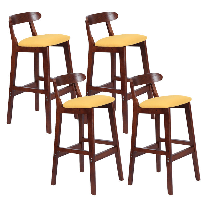 Modern Armless Counter Stool Wood Household Bar Stool with Pedal and Cushion Light Yellow Brown 4 Piece Set Clearhalo 'Bar Furniture' 'Bar Stools' 'bar_stools' 'furn' 'furn_bar_stools' 'furniture_bar_stools' 'Kitchen & Dining Furniture' 'kitchen&dining_furn' 'kitchen' 'kitchen_furn' Furniture' 4212116