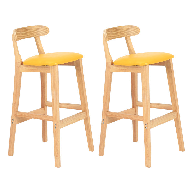 Modern Armless Counter Stool Wood Household Bar Stool with Pedal and Cushion Light Yellow Natural 2 Piece Set Clearhalo 'Bar Furniture' 'Bar Stools' 'bar_stools' 'furn' 'furn_bar_stools' 'furniture_bar_stools' 'Kitchen & Dining Furniture' 'kitchen&dining_furn' 'kitchen' 'kitchen_furn' Furniture' 4212127