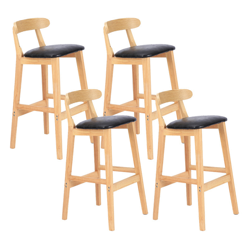 Modern Armless Counter Stool Wood Household Bar Stool with Pedal and Cushion Black Natural 4 Piece Set Clearhalo 'Bar Furniture' 'Bar Stools' 'bar_stools' 'furn' 'furn_bar_stools' 'furniture_bar_stools' 'Kitchen & Dining Furniture' 'kitchen&dining_furn' 'kitchen' 'kitchen_furn' Furniture' 4212158