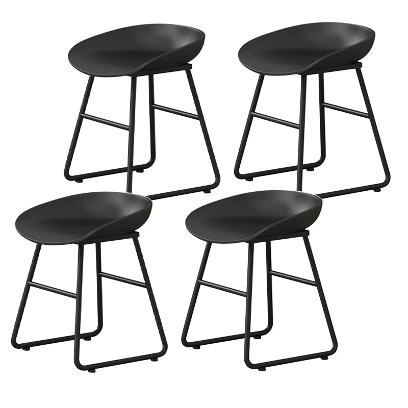 Contemporary Bucket Counter Bar Stool Armless Plastic Bar Stool with Footrest, Iron Base Black 4 Piece Set Short Stool(18"H) Clearhalo 'Bar Furniture' 'Bar Stools' 'bar_stools' 'furn' 'furn_bar_stools' 'furniture_bar_stools' 'Kitchen & Dining Furniture' 'kitchen&dining_furn' 'kitchen' 'kitchen_furn' Furniture' 4259091