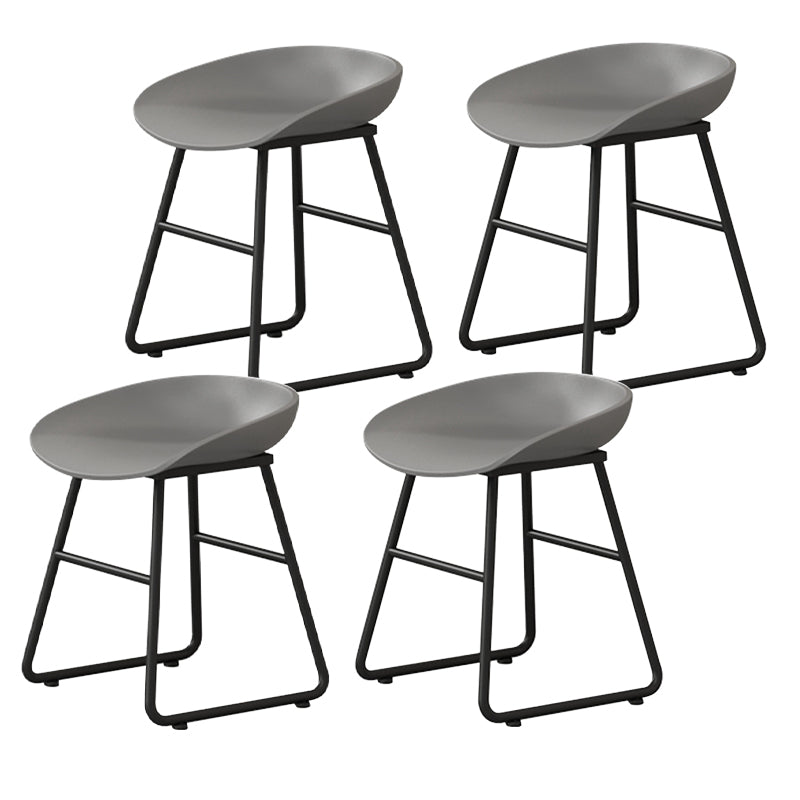 Contemporary Bucket Counter Bar Stool Armless Plastic Bar Stool with Footrest, Iron Base Gray 4 Piece Set Short Stool(18"H) Clearhalo 'Bar Furniture' 'Bar Stools' 'bar_stools' 'furn' 'furn_bar_stools' 'furniture_bar_stools' 'Kitchen & Dining Furniture' 'kitchen&dining_furn' 'kitchen' 'kitchen_furn' Furniture' 4259094
